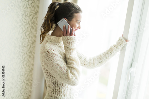Young woman with telephone ...