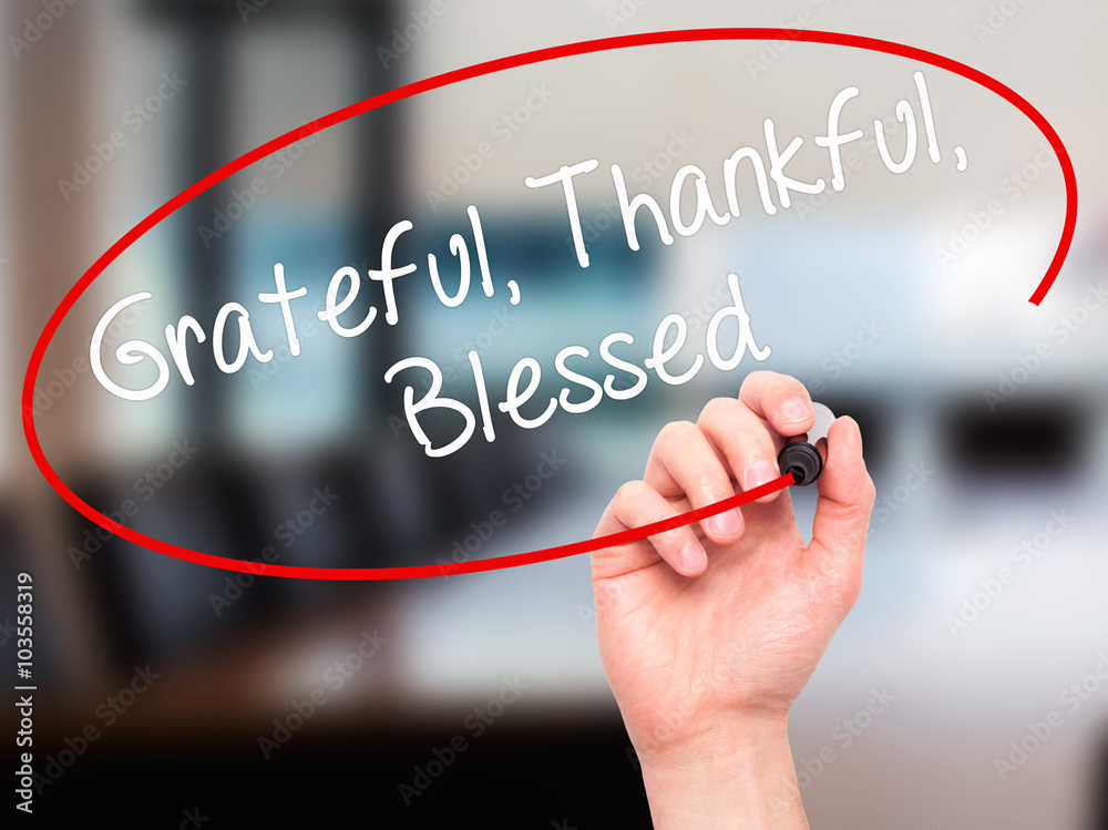 Man Hand writing Grateful Thankful Blessed with black marker on Man Hand writing Grateful Thankful Blessed with black marker on