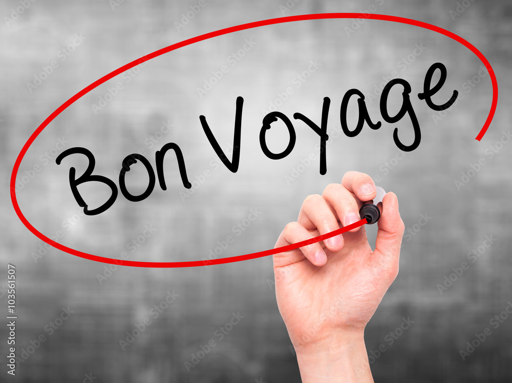 Man Hand writing Bon Voyage (Have a Good Trip In French) with Man Hand writing Bon Voyage (Have a Good Trip In French) with
