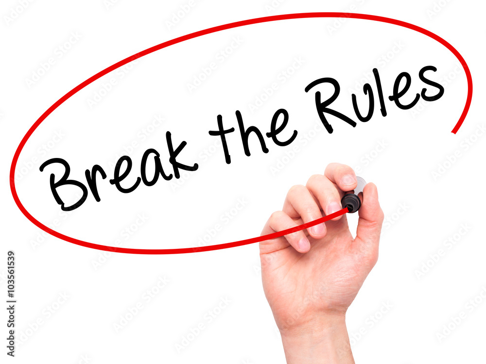 Man Hand writing Break the Rules with black marker on visual scr Man Hand writing Break the Rules with black marker on visual scr