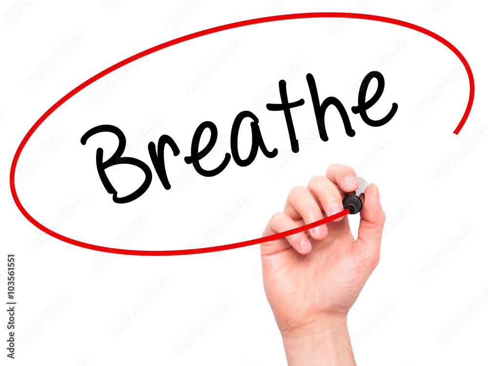 Man Hand writing Breathe with black marker on visual screen Man Hand writing Breathe with black marker on visual screen