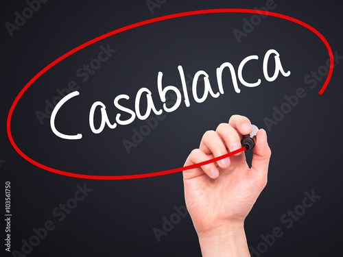 Man Hand writing Casablanca with black marker on visual screen