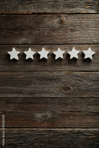 Decorative stars on a grey wooden background