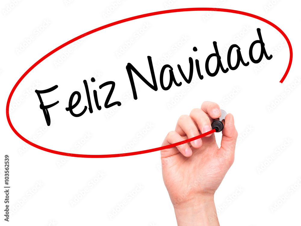 Man Hand writing Feliz Navidad (Merry Christmas In Spanish) wit Man Hand writing Feliz Navidad (Merry Christmas In Spanish) wit