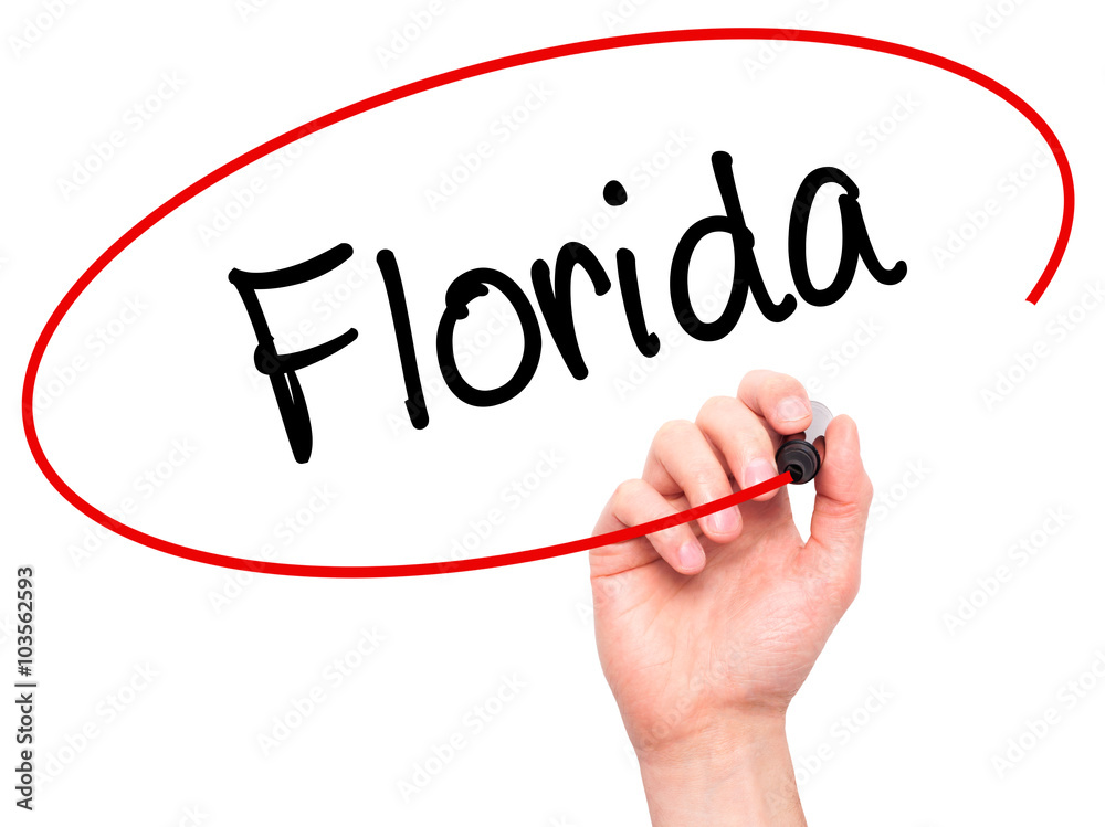 Man Hand writing Florida with black marker on visual screen Man Hand writing Florida with black marker on visual screen