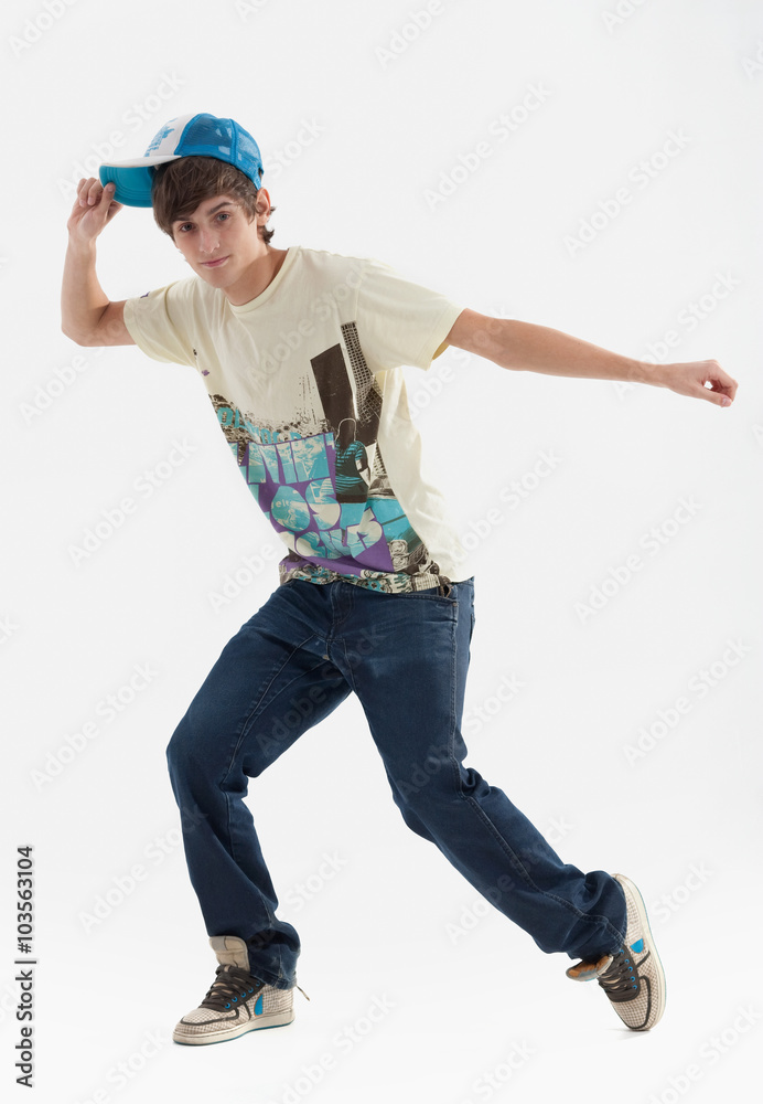 Young guy is dancing. Street dance. White background. Young guy is dancing. Street dance. White background.