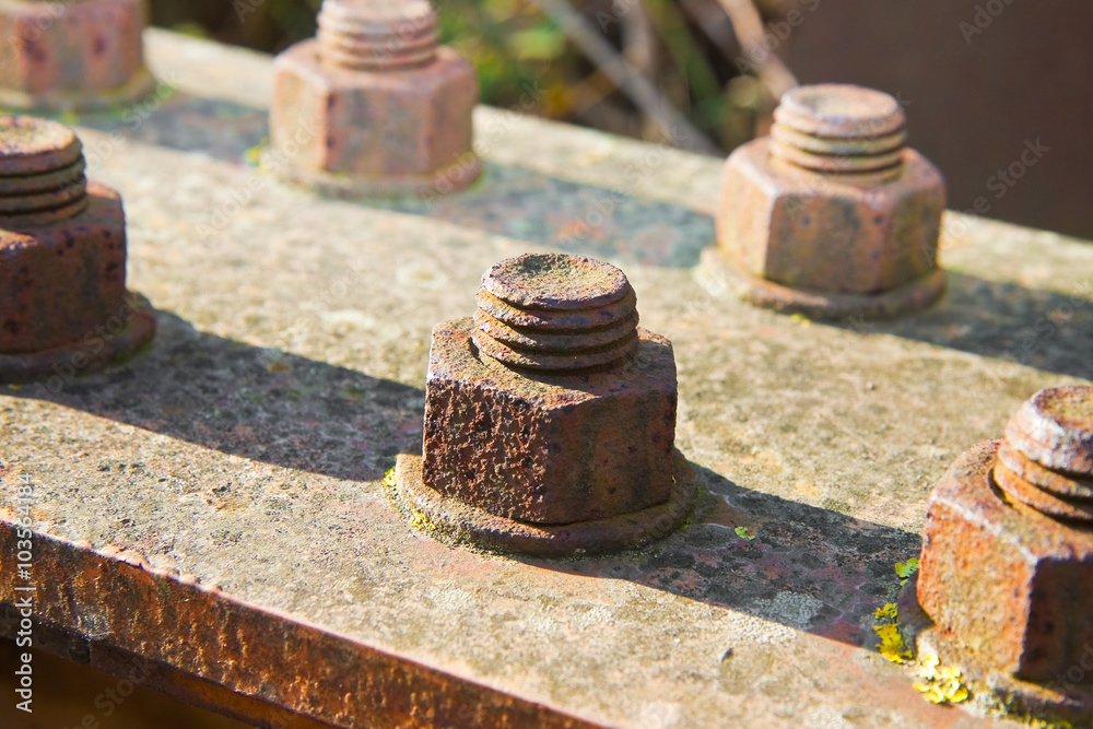 Old rusty anchor bolt with iron plate Old rusty anchor bolt with iron plate