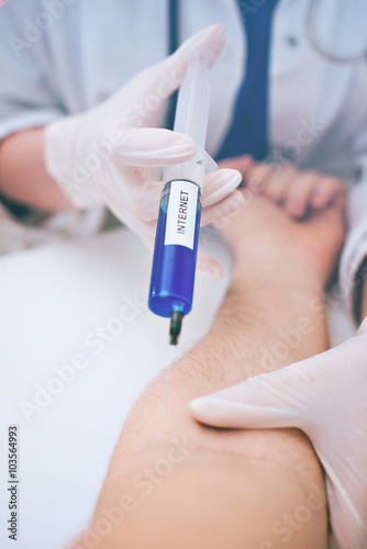 Doctor injecting patient with syringe. Internet addiction concept.