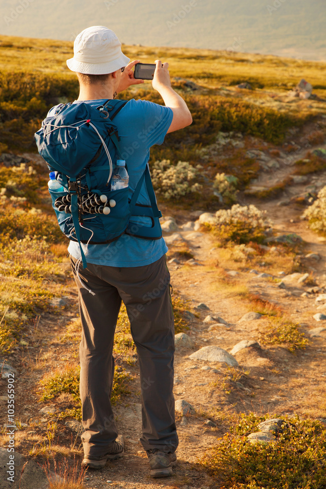 custom made wallpaper toronto digitalhiker taking photo of mountain landscape with smartphone