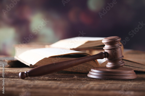 Law theme, mallet of judge, wooden gavel, books