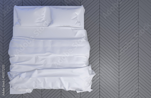 Bed with pillows and a blanket