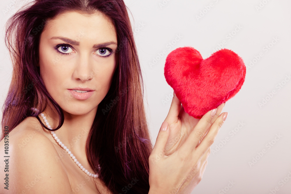 Beautiful woman holds red heart Beautiful woman holds red heart