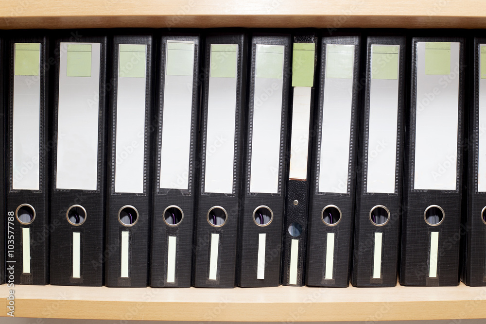 old files for documents on a book shelf at office old files for documents on a book shelf at office