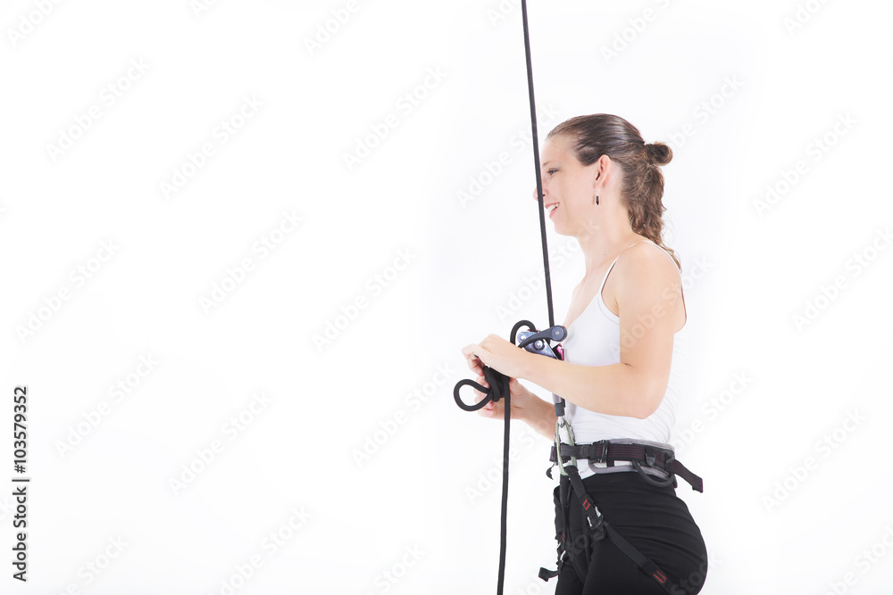 woman dressed executive with harnesses hanging from a climbing rope