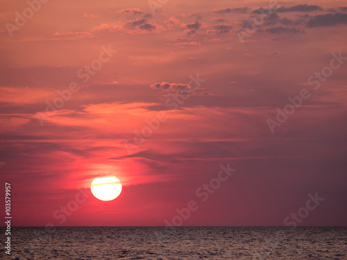 Beautiful sunset over Baltic Sea in Denmark colouring the sky in an intense red