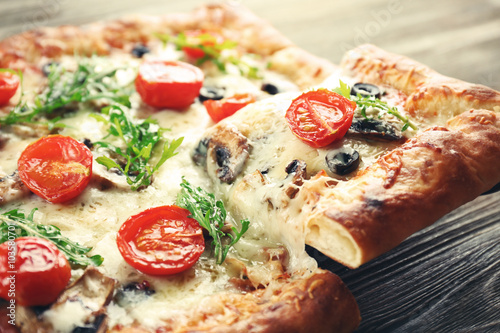 Piece of freshly homemade pizza closeup