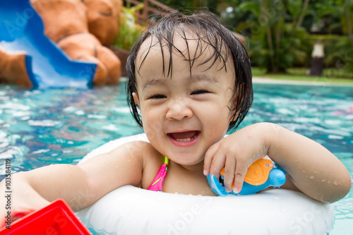 Asian Little Chinese Girl Playing in Swimming Pool
