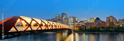 Calgary cityscape with Peace Bridge and downtown skyscrapers in Alberta at night, Canada. photo