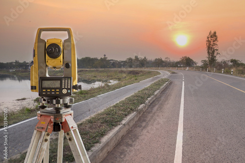 Surveyor equipment tacheometer or theodolite outdoors at constru photo