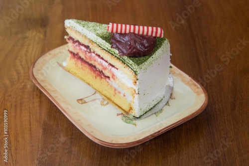Japanese Matcha Green tea cake with red bean jam topping in vint