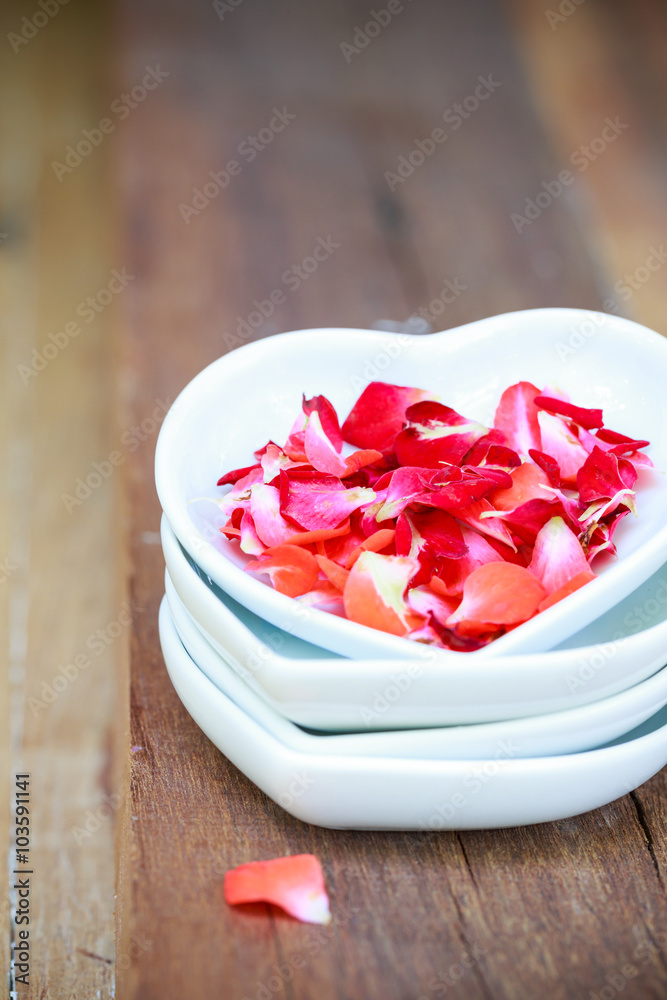 red rose and ceramic heart shape on old wooden red rose and ceramic heart shape on old wooden