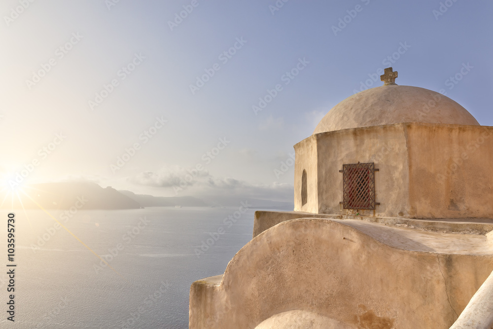 Sun on a church dome in Santorini
