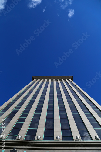 New alone skyscraper business center on blue sky background