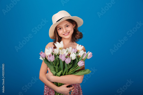 Cute happy little girl with bouquet of flowers © Drobot Dean