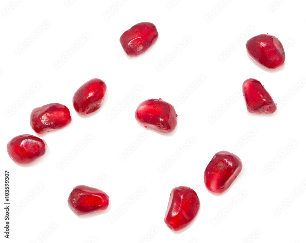 pomegranate seeds on a white background pomegranate seeds on a white background