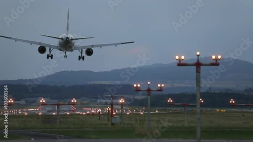 Amazing touchdown of huge plane in Zürich Airport during twilight time photo
