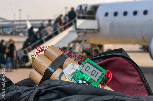 Dynamite bomb in bag in airport. Terrorism concept.