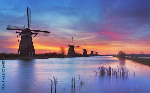 Traditional windmills at sunrise, Kinderdijk, The Netherlands © sara_winter