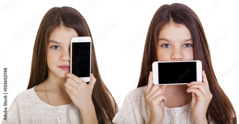 Happy little girl covers her face screen smartphone