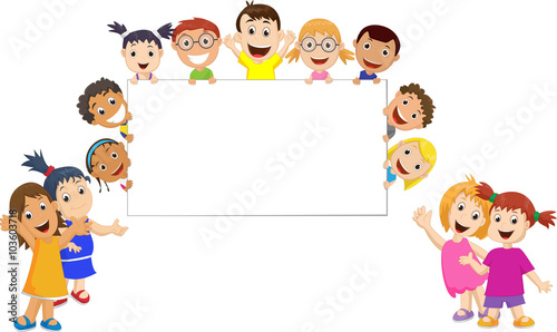 a group of children holding and showing a blank sign