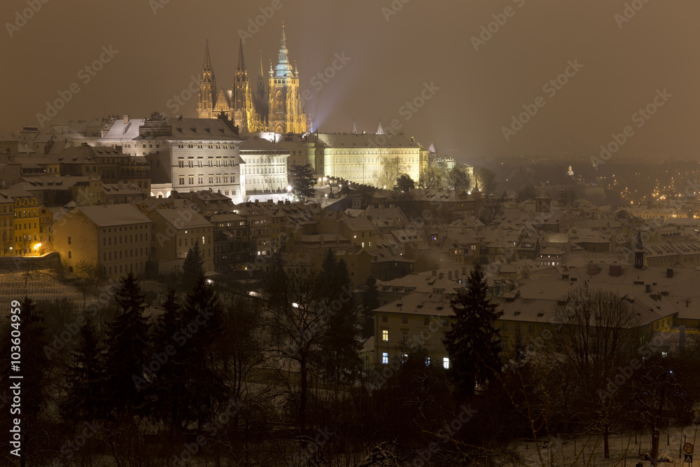 Fototapeta premium Night snowy foggy Prague City with gothic Castle, Czech republic
