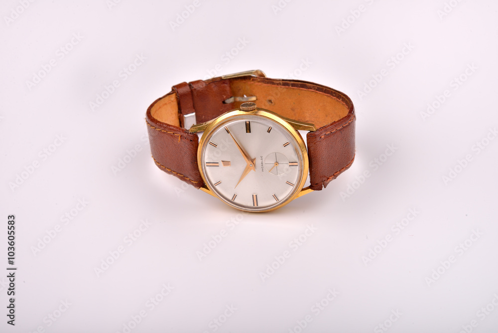 Old classic wristwatch for man with brown strap on white Old classic wristwatch for man with brown strap on white
