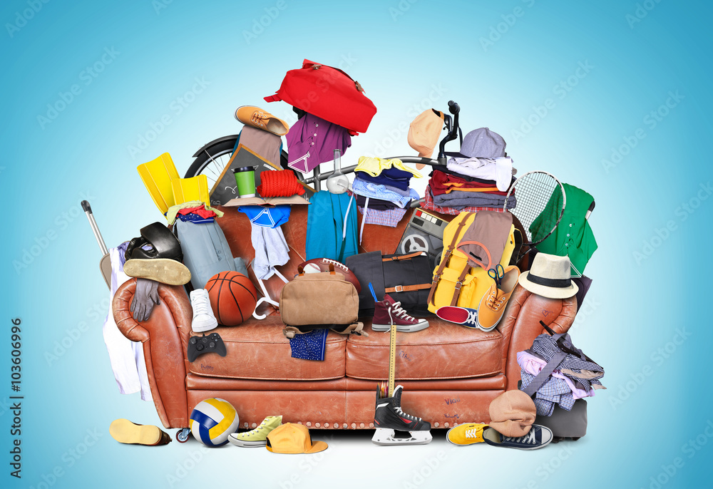 Naklejka premium Large leather sofa with a bunch of different things