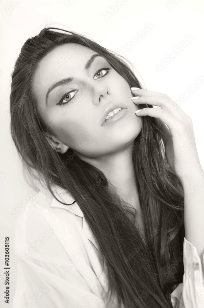 Fototapeta premium Close-up of beautiful wet woman face with water drop. On green b