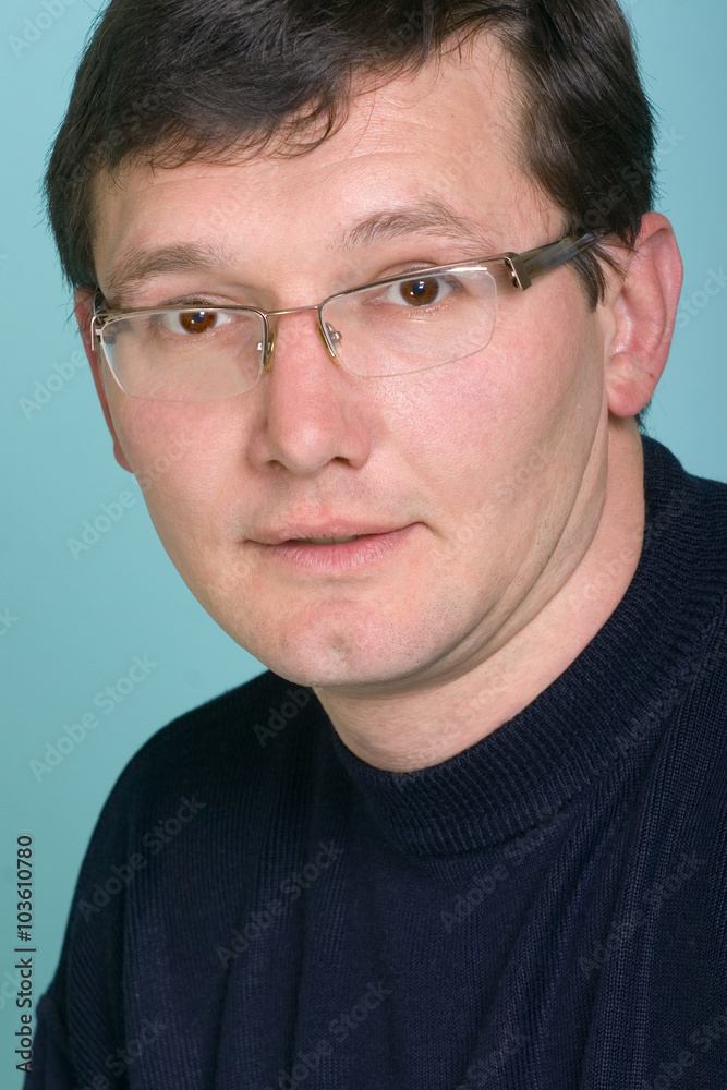 Pleasantly smiling the man in glasses largly Pleasantly smiling the man in glasses largly