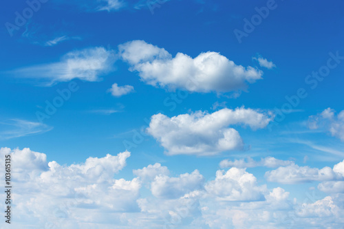 white fluffy clouds in the blue sky © ZaZa studio