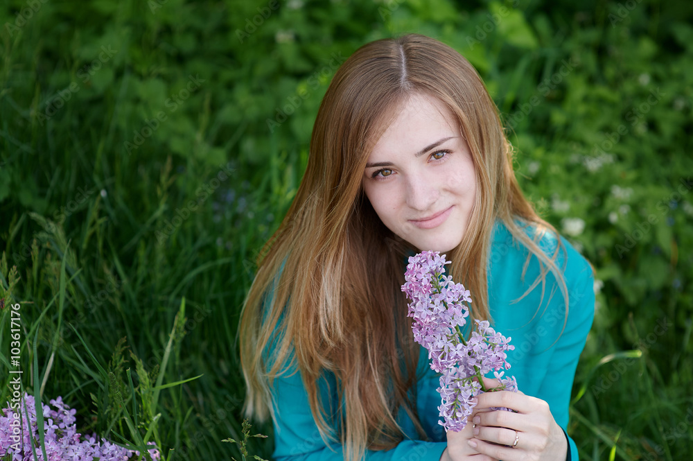 beautiful woman with a branch of lilac in the spring garden beautiful woman with a branch of lilac in the spring garden
