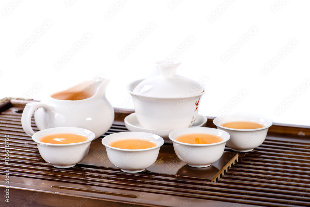 Chinese tea service cup of hot tea, close-up, isolated on white Chinese tea service cup of hot tea, close-up, isolated on white