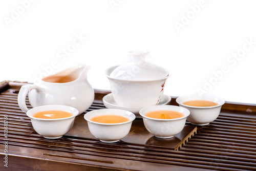 Chinese tea service cup of hot tea, close-up, isolated on white