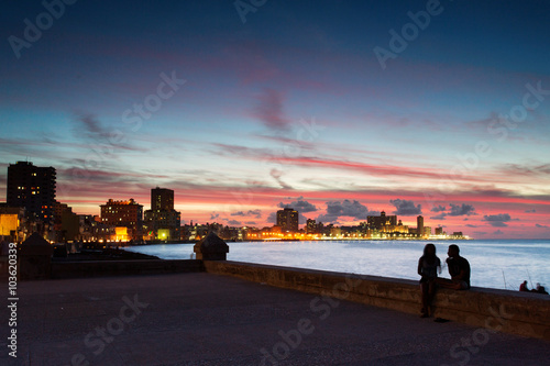 Sunset at Malecon, the famous Havana promenades where Habaneros,