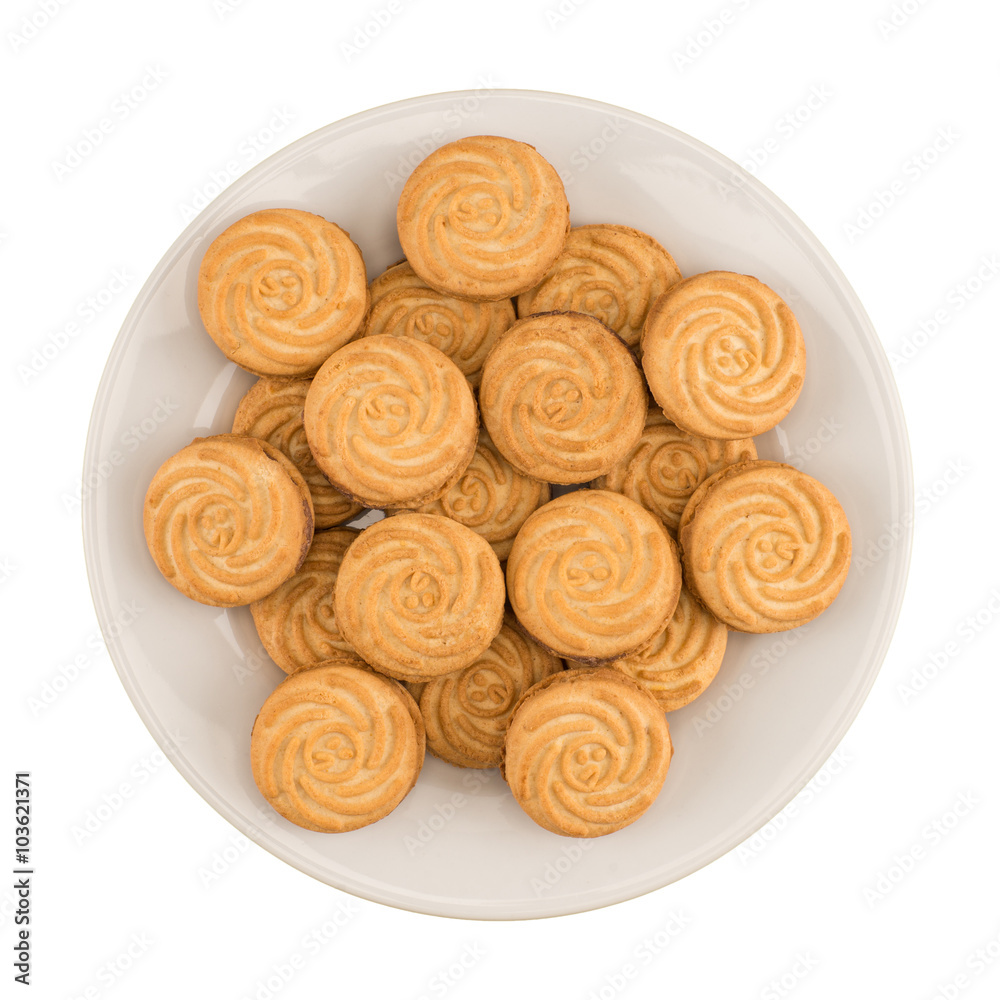 Tasty cookies in white plate on a white background Tasty cookies in white plate on a white background