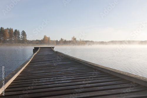 Fototapeta Naklejka Na Ścianę i Meble -  Finland, fog on the water / Finland is a country of thousands of lakes and islands, about 188 000 lakes and 179 000 islands. The area with the most lakes is called Finnish Lakeland.