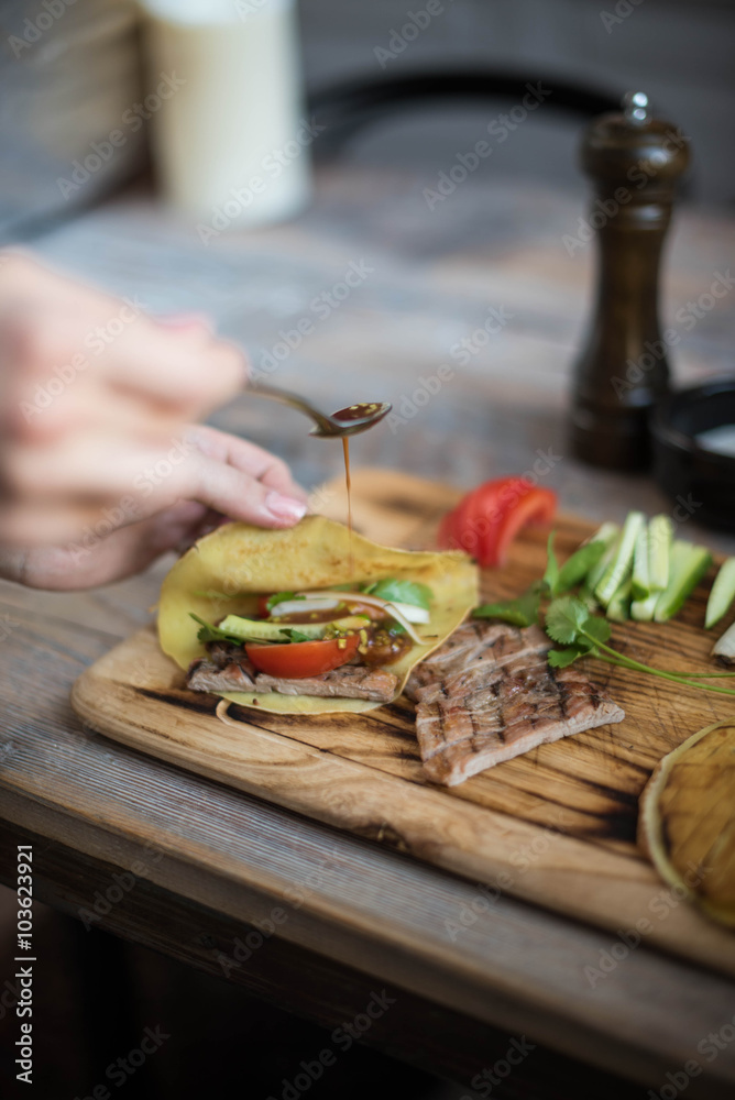 Tasty meat on a board with snacks and beer, top view. Photo for the menu Tasty meat on a board with snacks and beer, top view. Photo for the menu
