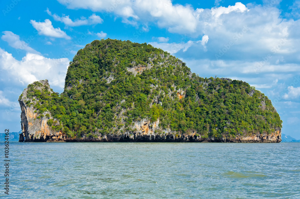Beautiful uninhabited green island in the open sea near Phuket in Thailand