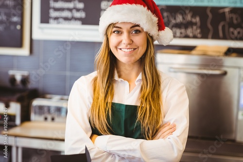 Cute waitress standing behind the counter