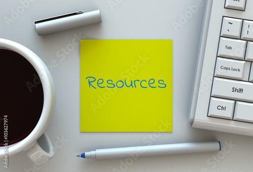Resources, message on note paper, computer and coffee on table photo